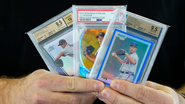 J.J. Hoover, former Cincinnati Reds pitcher, holds cards. J.J. Hoover, former Cincinnati Reds pitcher, holds cards.