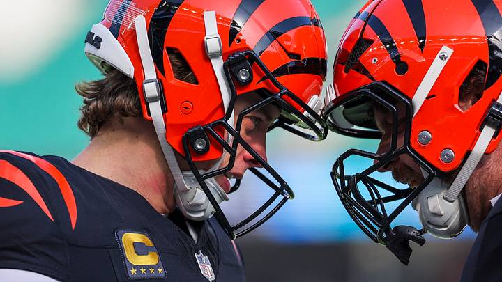 Jan 4, 2026; Cincinnati, Ohio, USA; Cincinnati Bengals quarterback Joe Burrow (9) and center Ted Karras (64) bump helmets during pregame warmups against the Cleveland Browns at Paycor Stadium. Mandatory Credit: Joseph Maiorana-Imagn Images Jan 4, 2026; Cincinnati, Ohio, USA; Cincinnati Bengals quarterback Joe Burrow (9) and center Ted Karras (64) bump helmets during pregame warmups against the Cleveland Browns at Paycor Stadium. Mandatory Credit: Joseph Maiorana-Imagn Images