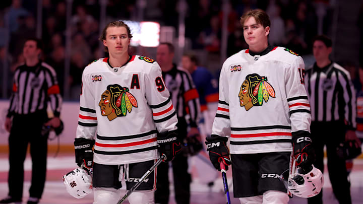 Mar 24, 2026; Elmont, New York, USA; Chicago Blackhawks centers Connor Bedard (98) and Anton Frondell (15) stand for the US national anthem before a game against the New York Islanders at UBS Arena. Mandatory Credit: Brad Penner-Imagn Images