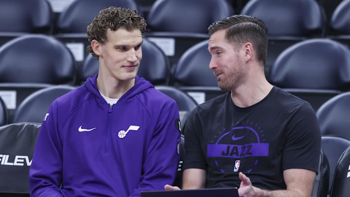 Nov 30, 2025; Salt Lake City, Utah, USA; Utah Jazz forward Lauri Markkanen. left, prepares for the game against the Houston Rockets with assistant coach Sean Sheldon, right,  at Delta Center. Mandatory Credit: Rob Gray-Imagn Images