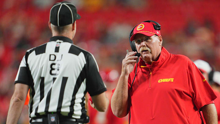 Aug 22, 2024; Kansas City, Missouri, USA; Kansas City Chiefs head coach Andy Reid talks with down judge Dana McKenzie (8) during the second half against the Chicago Bears at GEHA Field at Arrowhead Stadium. Mandatory Credit: Jay Biggerstaff-Imagn Images