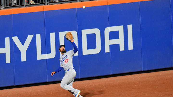 Oct 16, 2024; New York City, New York, USA; Los Angeles Dodgers outfielder Teoscar Hernandez (37) makes a catch against the New York Mets in the sixth inning during game three of the NLCS for the 2024 MLB playoffs at Citi Field.
