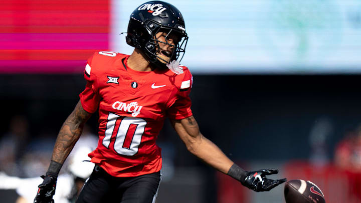 Cincinnati Bearcats wide receiver Caleb Goodie (10) drops a pass in the fourth quarter of the NCAA football game between the Cincinnati Bearcats and UCF Knights at Nippert Stadium in Cincinnati on Oct. 11, 2025. Cincinnati Bearcats wide receiver Caleb Goodie (10) drops a pass in the fourth quarter of the NCAA football game between the Cincinnati Bearcats and UCF Knights at Nippert Stadium in Cincinnati on Oct. 11, 2025.