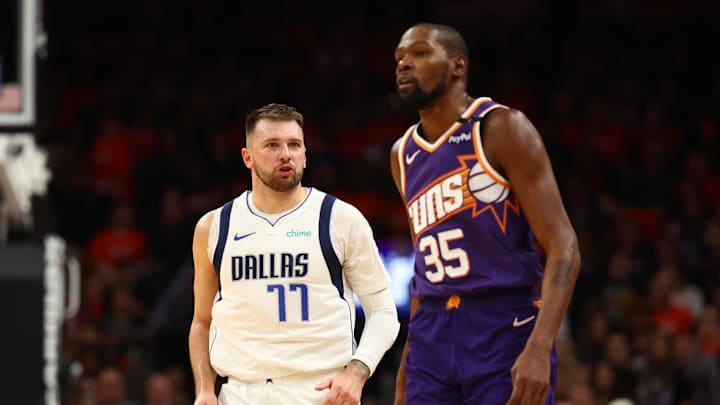 Oct 26, 2024; Phoenix, Arizona, USA; Dallas Mavericks guard Luka Doncic (77) against Phoenix Suns forward Kevin Durant (35) in the second half at Footprint Center. Mandatory Credit: Mark J. Rebilas-Imagn Images