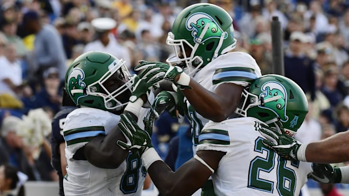 Sep 9, 2017; Annapolis, MD, USA; Tulane Green Wave tight end Charles Jones II (84) celebrates with teammates after scoring on a two-point conversion during the fourth quarter against the Navy Midshipmen at Navy-Marine Corps Memorial Stadium. Navy Midshipmen defeated Tulane Green Wave 23-21. Sep 9, 2017; Annapolis, MD, USA; Tulane Green Wave tight end Charles Jones II (84) celebrates with teammates after scoring on a two-point conversion during the fourth quarter against the Navy Midshipmen at Navy-Marine Corps Memorial Stadium. Navy Midshipmen defeated Tulane Green Wave 23-21.