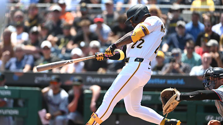 Jun 11, 2025; Pittsburgh, Pennsylvania, USA;  Pittsburgh Pirates designated hitter Andrew McCutchen (22) hits a home run against the Miami Marlins during the fifth inning at PNC Park. The home run was his 241st and putting him ahead of Roberto Clemente on the Pirates all-time home run list with 241. Mandatory Credit: Philip G. Pavely-Imagn Images