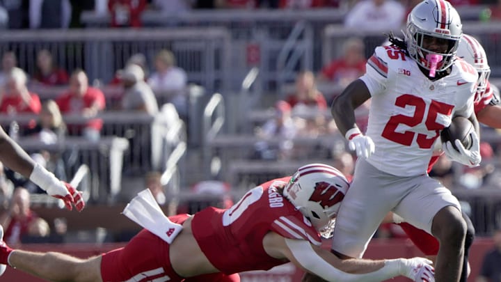Ohio State running back Bo Jackson (25) is tripped up by Wisconsin linebacker Christian Alliegro (0) during the first quarter of their game Saturday, October 18, 2025 at Camp Randall Stadium in Madison, Wisconsin.