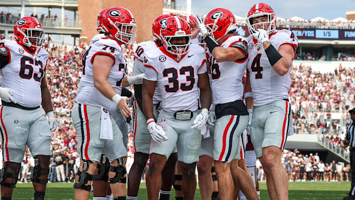 Nov 8, 2025; Starkville, Mississippi, USA; Georgia Bulldogs running back Chauncey Bowens (33) reacts after a touchdown against the Mississippi State Bulldogs during the first half at Davis Wade Stadium at Scott Field. Mandatory Credit: Wesley Hale-Imagn Images