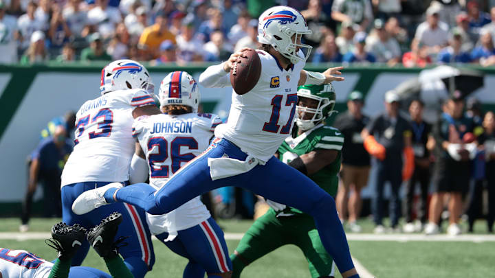 Buffalo Bills quarterback Josh Allen hurdles a tackle against the New York Jets during the first half at MetLife Stadium.