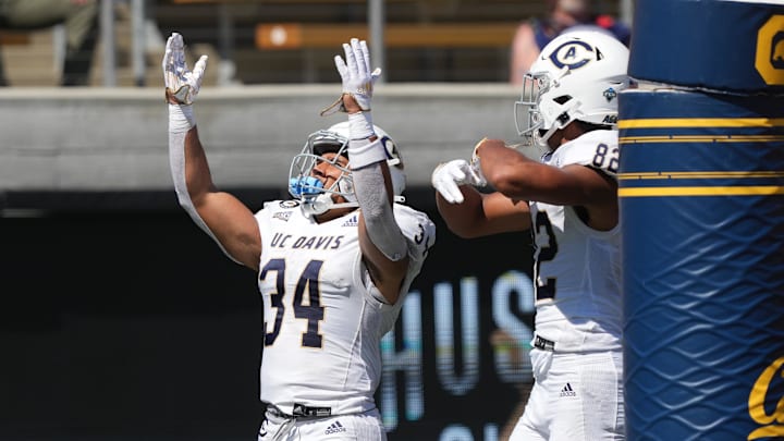 Sep 3, 2022; Berkeley, California, USA; UC Davis Aggies defensive back Kavir Bains (43) celebrates with wide receiver Chaz Davis (82) after scoring a touchdown against the California Golden Bears during the third quarter at FTX Field at California Memorial Stadium. Mandatory Credit: Darren Yamashita-Imagn Images Sep 3, 2022; Berkeley, California, USA; UC Davis Aggies defensive back Kavir Bains (43) celebrates with wide receiver Chaz Davis (82) after scoring a touchdown against the California Golden Bears during the third quarter at FTX Field at California Memorial Stadium. Mandatory Credit: Darren Yamashita-Imagn Images