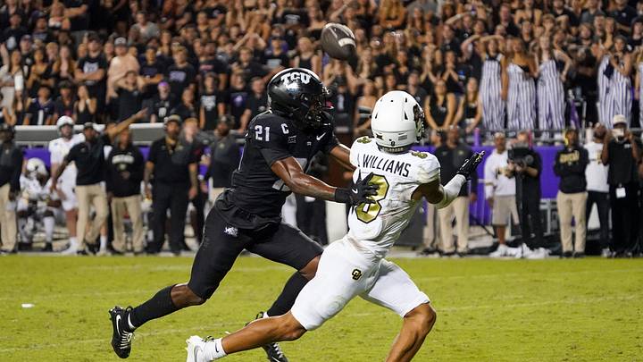 Oct 4, 2025; Fort Worth, Texas, USA; TCU Horned Frogs safety Bud Clark (21) breaks up the pass to Colorado Buffaloes wide receiver Joseph Williams (8) during the second half at Amon G. Carter Stadium. Mandatory Credit: Raymond Carlin III-Imagn Images