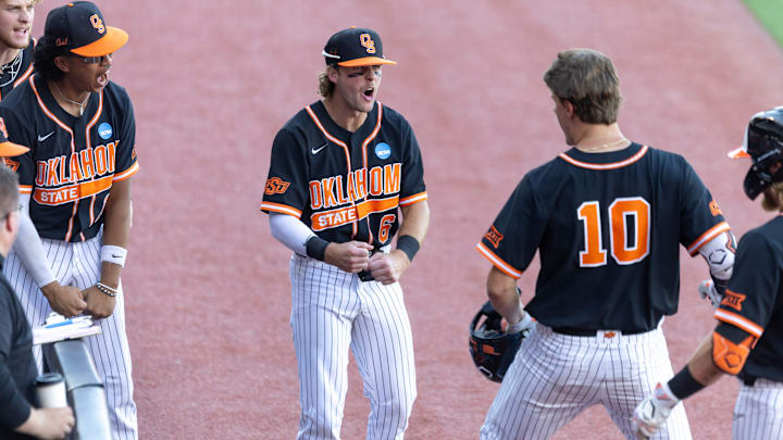 Jun 1, 2024; Stillwater, OK, USA; Oklahoma State infielder Lane Forsythe (6) celebrates with outfielder Nolan Schubart (10) by the dugout during a NCAA regional baseball game against Florida at O'Brate Stadium. Mandatory Credit: Mitch Alcala-The Oklahoman