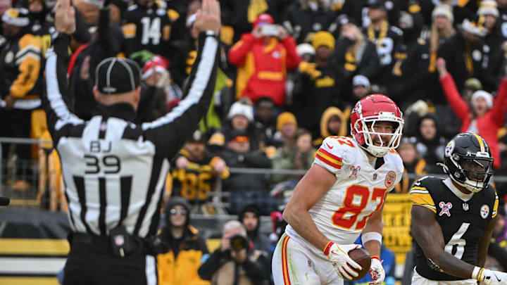 Dec 25, 2024; Pittsburgh, Pennsylvania, USA; Kansas City Chiefs tight end Travis Kelce (87) celebrates a touchdown in front of Pittsburgh Steelers linebacker Patrick Queen (6) during the second half at Acrisure Stadium. Mandatory Credit: Barry Reeger-Imagn Images