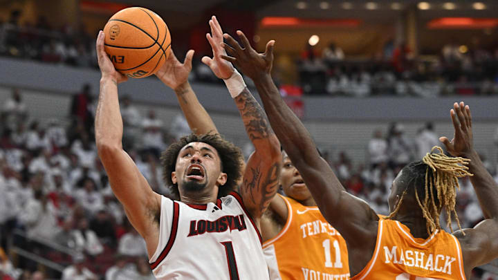 Nov 9, 2024; Louisville, Kentucky, USA; Louisville Cardinals guard J'Vonne Hadley (1) shoots against Tennessee Volunteers guard Jordan Gainey (11) and guard Jahmai Mashack (15) during the second half at KFC Yum! Center. Tennessee defeated Louisville 77-55. Mandatory Credit: Jamie Rhodes-Imagn Images Nov 9, 2024; Louisville, Kentucky, USA; Louisville Cardinals guard J'Vonne Hadley (1) shoots against Tennessee Volunteers guard Jordan Gainey (11) and guard Jahmai Mashack (15) during the second half at KFC Yum! Center. Tennessee defeated Louisville 77-55. Mandatory Credit: Jamie Rhodes-Imagn Images