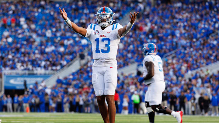 Sep 6, 2025; Lexington, Kentucky, USA; Mississippi Rebels quarterback Austin Simmons (13) celebrates after scoring a touchdown during the fourth quarter against the Kentucky Wildcats at Kroger Field. Mandatory Credit: Jordan Prather-Imagn Images