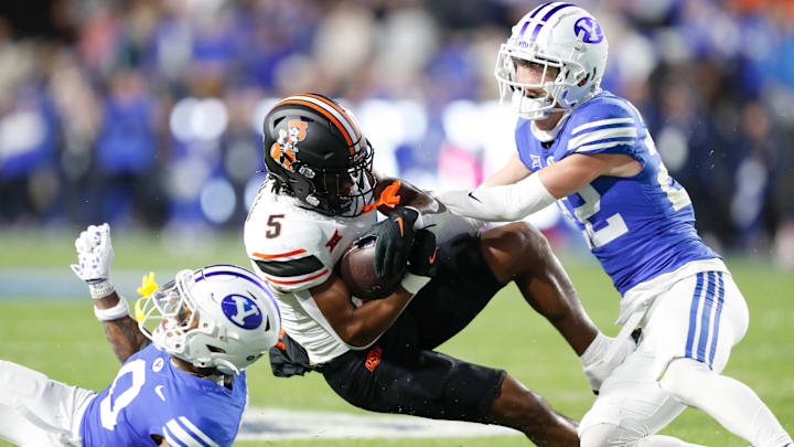 BYU defenders struggle to slow down the Oklahoma State offense in a Friday night clash in Provo