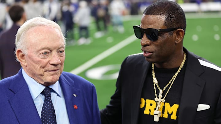 Nov 30, 2023; Arlington, Texas, USA; Colorado Buffaloes head coach Deion Sanders (right) talks with Dallas Cowboys owner Jerry Jones before the game against the Seattle Seahawks at AT&T Stadium. Mandatory Credit: Tim Heitman-Imagn Images