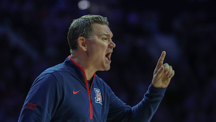 Feb 11, 2025; Manhattan, Kansas, USA; Arizona Wildcats head coach Tommy Lloyd yells at his team during the first half against the Kansas State Wildcats at Bramlage Coliseum. Mandatory Credit: Scott Sewell-Imagn Images Feb 11, 2025; Manhattan, Kansas, USA; Arizona Wildcats head coach Tommy Lloyd yells at his team during the first half against the Kansas State Wildcats at Bramlage Coliseum. Mandatory Credit: Scott Sewell-Imagn Images