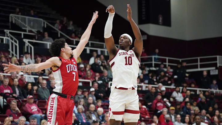 Dec 7, 2025; Stanford, California, USA; Stanford Cardinal forward Chisom Okpara (10) shoots a three-point basket over UNLV Runnin' Rebels guard Al Green (7) in the first half at Maples Pavilion. Mandatory Credit: David Gonzales-Imagn Images Dec 7, 2025; Stanford, California, USA; Stanford Cardinal forward Chisom Okpara (10) shoots a three-point basket over UNLV Runnin' Rebels guard Al Green (7) in the first half at Maples Pavilion. Mandatory Credit: David Gonzales-Imagn Images