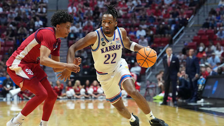 Mar 22, 2026; San Diego, CA, USA; Kansas Jayhawks guard Darryn Peterson (22) controls the ball against St. John's Red Storm guard Oziyah Sellers (4) in the second half during a second round game of the men's 2026 NCAA Tournament at Viejas Arena. Mandatory Credit: Kirby Lee-Imagn Images