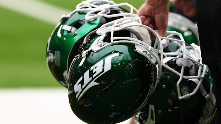 Oct 6, 2024; Tottenham, ENG; New York Jets helmets are held by staff before the match against Minnesota Vikings at Tottenham Hotspur Stadium. Mandatory Credit: Shaun Brooks-Imagn Images