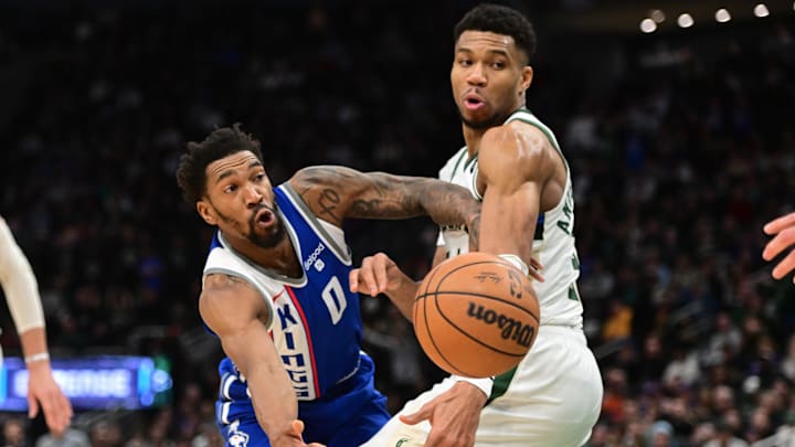 Jan 14, 2024; Milwaukee, Wisconsin, USA; Sacramento Kings guard Malik Monk (0) passes the ball away from Milwaukee Bucks forward Giannis Antetokounmpo (34) in overtime at Fiserv Forum. Mandatory Credit: Benny Sieu-Imagn Images Jan 14, 2024; Milwaukee, Wisconsin, USA; Sacramento Kings guard Malik Monk (0) passes the ball away from Milwaukee Bucks forward Giannis Antetokounmpo (34) in overtime at Fiserv Forum. Mandatory Credit: Benny Sieu-Imagn Images