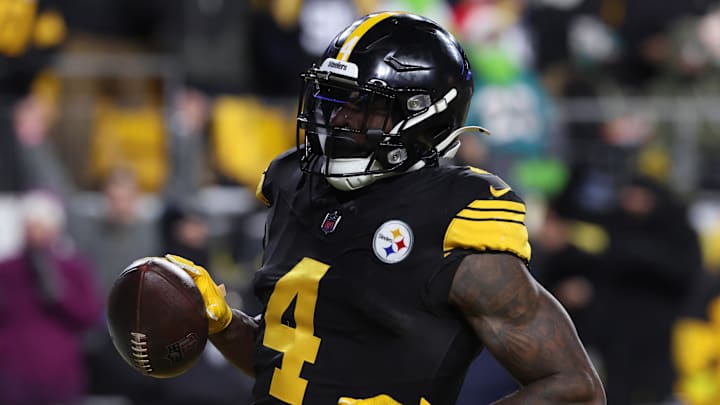 Dec 15, 2025; Pittsburgh, Pennsylvania, USA; Pittsburgh Steelers wide receiver DK Metcalf (4) scores a touchdown in the third quarter against the Miami Dolphins at Acrisure Stadium. Mandatory Credit: Charles LeClaire-Imagn Images