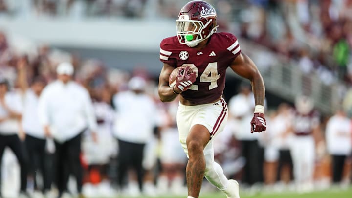 Sep 13, 2025; Starkville, Mississippi, USA; Mississippi State Bulldogs running back Fluff Bothwell (24) runs with the ball against the Alcorn State Braves during the second quarter at Davis Wade Stadium at Scott Field. Mandatory Credit: Wesley Hale-Imagn Images