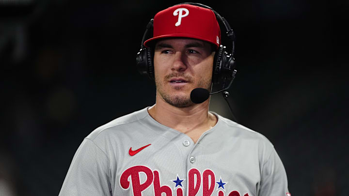 Philadelphia Phillies catcher J.T. Realmuto (10) is interviewed following a win against the Colorado Rockies at Coors Field.