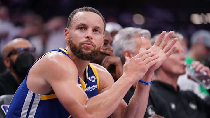 Apr 16, 2024; Sacramento, California, USA; Golden State Warriors guard Stephen Curry (30) sits on the bench during action against the Sacramento Kings in the fourth quarter during a play-in game of the 2024 NBA playoffs at the Golden 1 Center. Mandatory Credit: Cary Edmondson-USA TODAY Sports