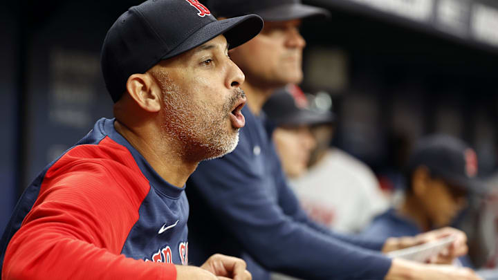 Boston Red Sox manager Alex Cora (13) reacts against the Tampa Bay Rays during the seventh inning at Tropicana Field.