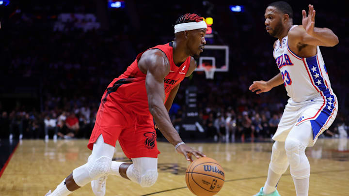 Nov 18, 2024; Miami, Florida, USA; Miami Heat forward Jimmy Butler (22) drives to the basket against Philadelphia 76ers guard Eric Gordon (23) during the second quarter at Kaseya Center. Mandatory Credit: Sam Navarro-Imagn Images