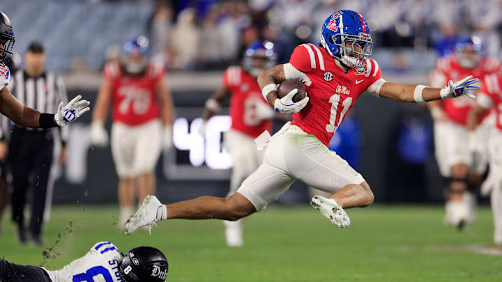 Mississippi Rebels wide receiver Jordan Watkins (11) breaks a final attempted tackle from Duke Blue Devils safety DaShawn Stone (8) en route to a touchdown during the fourth quarter of the TaxSlayer Gator Bowl Thursday, Jan. 2, 2025 at EverBank Stadium in Jacksonville, Fla. Ole Miss defeated Duke 52-20. [Corey Perrine/Florida Times-Union]