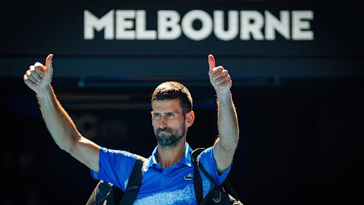 Novak Djokovic salutes fans before leaving his tennis match against Alexander Zverev at the Australian Open.