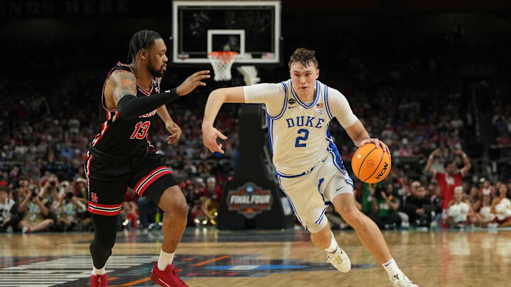 Apr 5, 2025; San Antonio, TX, USA; Duke Blue Devils forward Cooper Flagg (2) dribbles the ball against Houston Cougars forward J'Wan Roberts (13) during the second half in the semifinals of the men's Final Four of the 2025 NCAA Tournament at the Alamodome. Mandatory Credit: Bob Donnan-Imagn Images