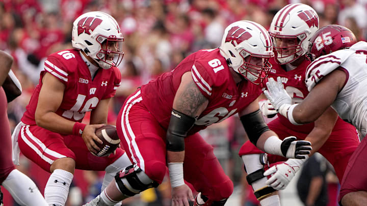 Wisconsin offensive lineman Dylan Barrett (61) snaps the ball to quarterback Myles Burkett (16) during the fourth quarter of their game Saturday, September 17, 2022 at Camp Randall Stadium in Madison, Wis. Wisconsin beat New Mexico State 66-7.

Mjs Uwgrid17 44 Jpg Uwgrid17 114441330