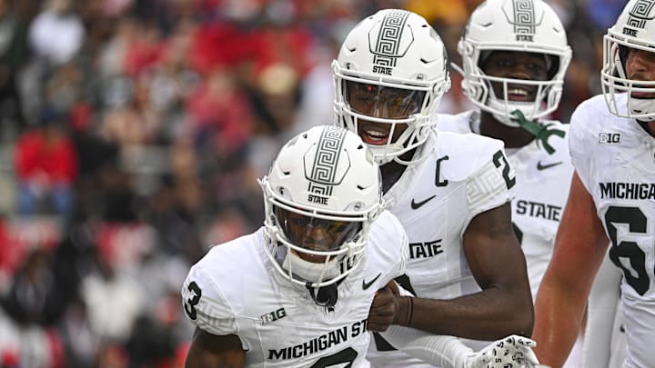 Sep 7, 2024; College Park, Maryland, USA; Michigan State Spartans wide receiver Montorie Foster Jr. (3) and quarterback Aidan Chiles (2) celebrate after a first half touchdown against the Maryland Terrapins at SECU Stadium. Mandatory Credit: Tommy Gilligan-Imagn Images