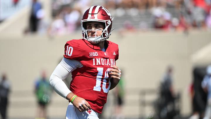 Sep 5, 2026; Bloomington, Indiana, USA;  Indiana Hoosiers quarterback Josh Hoover (10) runs onto the field during the fourth quarter against the North Texas Mean Green at Merchants Bank Field at Memorial Stadium.  Mandatory Credit: Robert Goddin-Imagn Images