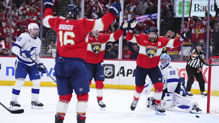 Apr 28, 2025; Sunrise, Florida, USA; Florida Panthers defenseman Aaron Ekblad (5) celebrates with teammates after scoring against the Tampa Bay Lightning during the third period in game four of the first round of the 2025 Stanley Cup Playoffs at Amerant Bank Arena. Mandatory Credit: Rich Storry-Imagn Images