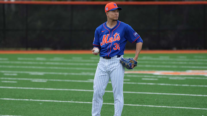 Feb 19, 2024; Port St. Lucie, FL, USA; New York Mets starting pitcher Kodai Senga (34) warms-up