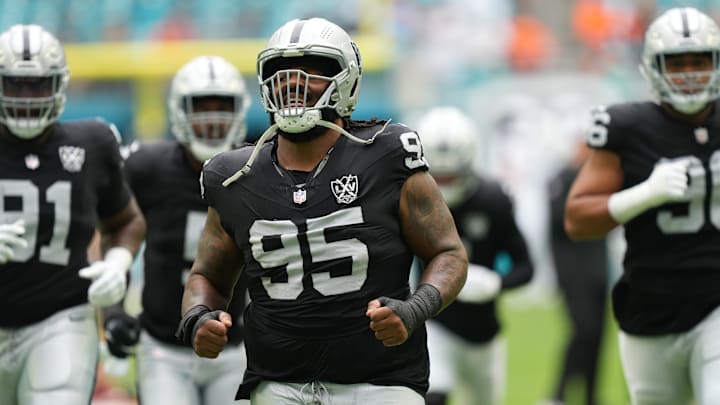 Nov 17, 2024; Miami Gardens, Florida, USA; Las Vegas Raiders defensive tackle John Jenkins (95) warms-up before the game against the Miami Dolphins at Hard Rock Stadium. Mandatory Credit: Jim Rassol-Imagn Images