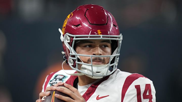 Dec 27, 2024; Las Vegas, NV, USA; Southern California Trojans quarterback Jayden Maiava (14) throws the ball against the Texas A&M Aggies in the first half at Allegiant Stadium. Mandatory Credit: Kirby Lee-Imagn Images Dec 27, 2024; Las Vegas, NV, USA; Southern California Trojans quarterback Jayden Maiava (14) throws the ball against the Texas A&M Aggies in the first half at Allegiant Stadium. Mandatory Credit: Kirby Lee-Imagn Images