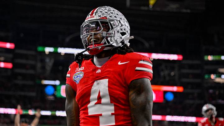 Dec 31, 2025; Arlington, TX, USA; Ohio State Buckeyes wide receiver Jeremiah Smith (4) celebrates after he runs for a touchdown during the 2025 Cotton Bowl and quarterfinal game of the College Football Playoff at AT&T Stadium. Mandatory Credit: Jerome Miron-Imagn Images Dec 31, 2025; Arlington, TX, USA; Ohio State Buckeyes wide receiver Jeremiah Smith (4) celebrates after he runs for a touchdown during the 2025 Cotton Bowl and quarterfinal game of the College Football Playoff at AT&T Stadium. Mandatory Credit: Jerome Miron-Imagn Images
