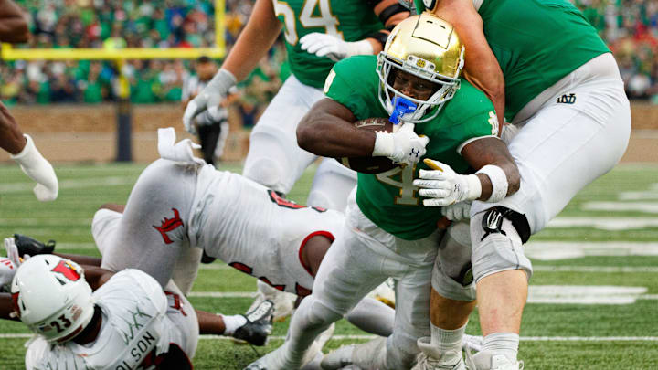 Notre Dame running back Jeremiyah Love (4) falls into the end zone for a touchdown during a NCAA college football game between Notre Dame and Louisville at Notre Dame Stadium on Saturday, Sept. 28, 2024, in South Bend. Notre Dame running back Jeremiyah Love (4) falls into the end zone for a touchdown during a NCAA college football game between Notre Dame and Louisville at Notre Dame Stadium on Saturday, Sept. 28, 2024, in South Bend.