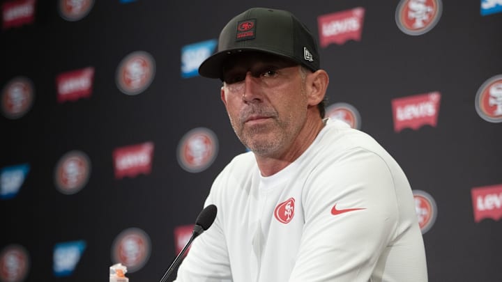 Jul 23, 2025; Santa Clara, CA, USA; San Francisco 49ers head coach Kyle Shanahan answers questions from reporters following the first day of training camp at SAP Performance Facility. Mandatory Credit: D. Ross Cameron-Imagn Images