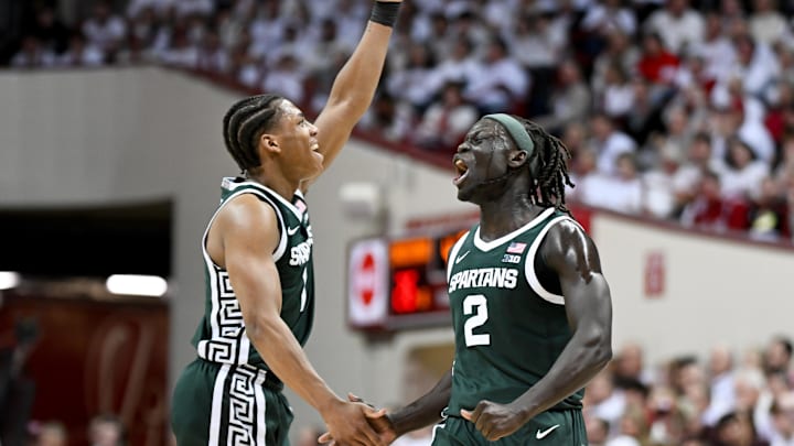 Mar 1, 2026; Bloomington, Indiana, USA; Michigan State Spartans guard Jeremy Fears Jr. (1) and Michigan State Spartans guard Kur Teng (2) celebrate against the Indiana Hoosiers during the first half at Simon Skjodt Assembly Hall. Mandatory Credit: Robert Goddin-Imagn Images Mar 1, 2026; Bloomington, Indiana, USA; Michigan State Spartans guard Jeremy Fears Jr. (1) and Michigan State Spartans guard Kur Teng (2) celebrate against the Indiana Hoosiers during the first half at Simon Skjodt Assembly Hall. Mandatory Credit: Robert Goddin-Imagn Images