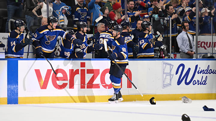 Feb 26, 2026; St. Louis, Missouri, USA; St. Louis Blues left wing Dylan Holloway (81) is congratulated after scoring his third goal for a hat trick against the Seattle Kraken during the third period at Enterprise Center. Mandatory Credit: Joe Puetz-Imagn Images Feb 26, 2026; St. Louis, Missouri, USA; St. Louis Blues left wing Dylan Holloway (81) is congratulated after scoring his third goal for a hat trick against the Seattle Kraken during the third period at Enterprise Center. Mandatory Credit: Joe Puetz-Imagn Images