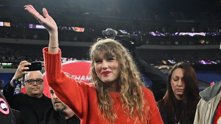 Jan 28, 2024; Baltimore, Maryland, USA; American singer-songwriter Taylor Swift (center) walks off