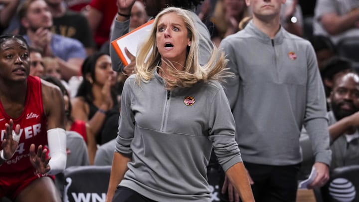 Sep 13, 2024; Indianapolis, Indiana, USA; Indiana Fever head coach Christie Sides reacts to a call Friday, Sept. 13, 2024, during a game between the Indiana Fever and the Las Vegas Aces on Friday, Sept. 13, 2024, at Gainbridge Fieldhouse in Indianapolis. The Aces defeated the Fever, 78-74. Mandatory Credit: Grace Smith/USA TODAY Network via Imagn Images Sep 13, 2024; Indianapolis, Indiana, USA; Indiana Fever head coach Christie Sides reacts to a call Friday, Sept. 13, 2024, during a game between the Indiana Fever and the Las Vegas Aces on Friday, Sept. 13, 2024, at Gainbridge Fieldhouse in Indianapolis. The Aces defeated the Fever, 78-74. Mandatory Credit: Grace Smith/USA TODAY Network via Imagn Images
