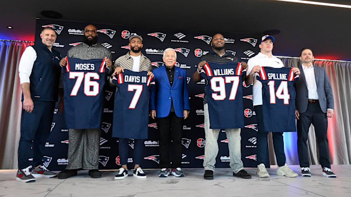 Mar 13, 2025; Foxborough, MA, USA; The New England Patriots hold a press conference at the GP Atrium at Gillette Stadium to introduce free agency additions to the team. (Left to right) New England Patriots head coach Mike Vrabel, offensive tackle Morgan Moses, cornerback Carlton Davis III, owner Robert Kraft, defensive tackle Milton Williams, linebacker Robert Spillane and executive vice president of player personnel Eliot Wolf. Mandatory Credit: Eric Canha-Imagn Images